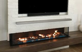 double corner three sided fireplace with LED lights