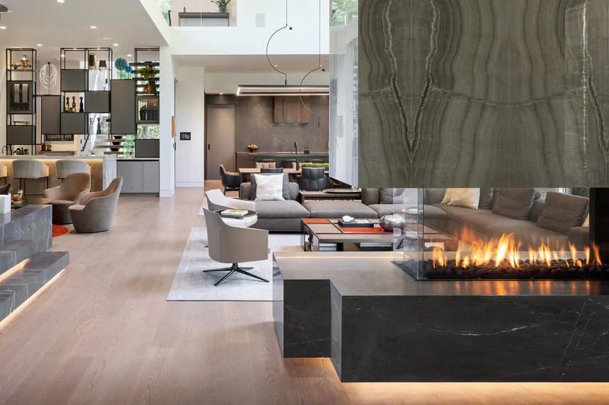 Three sided peninsula gas fireplace, Flare Room Definer 70, in an open-concept living space.