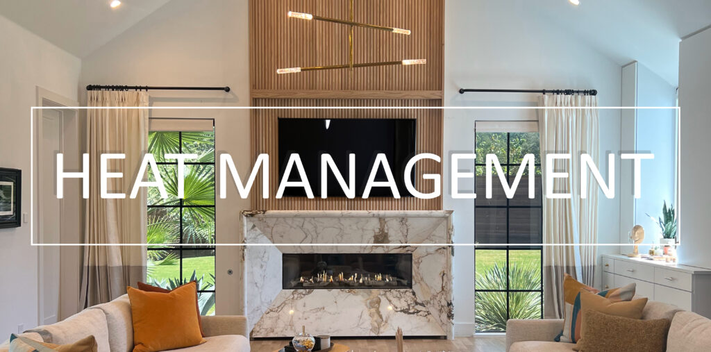 Elegant living room with a modern linear direct vent fireplace framed by luxurious marble and wood paneling, incorporating advanced heat management technology.