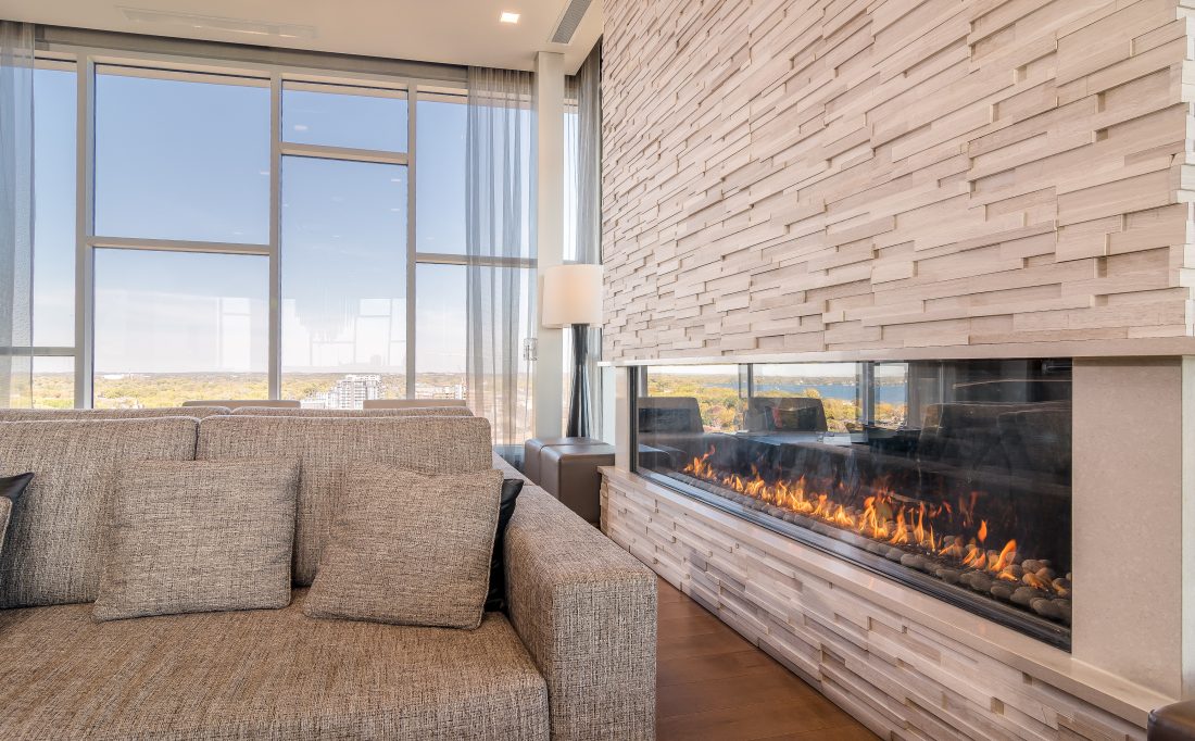 Flare indoor-outdoor fireplace connecting hotel lounge and rooftop patio