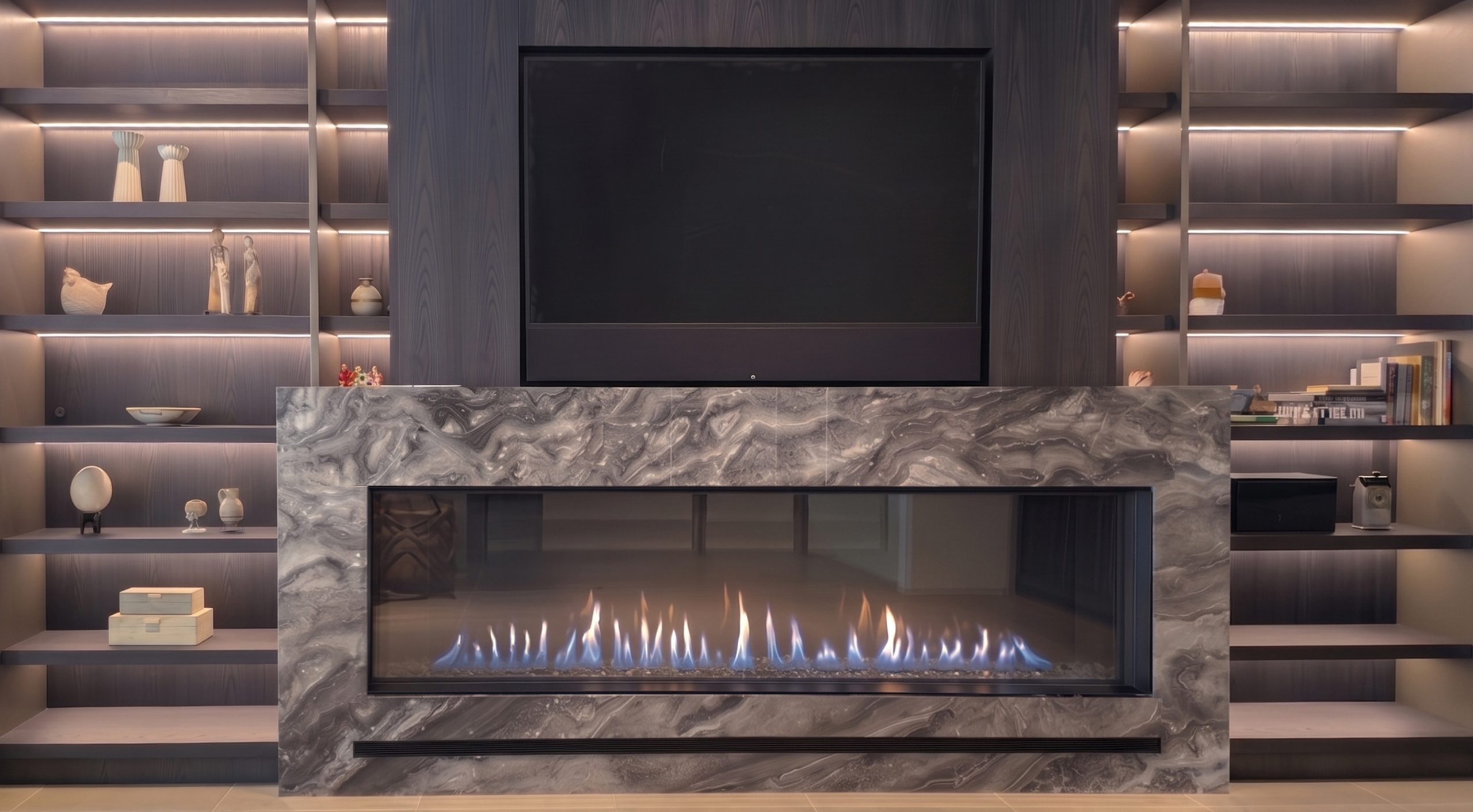 Front Facing 80" x 24" direct vent fireplace installed below a wall-mounted TV with a gray stone surround and built-in shelving