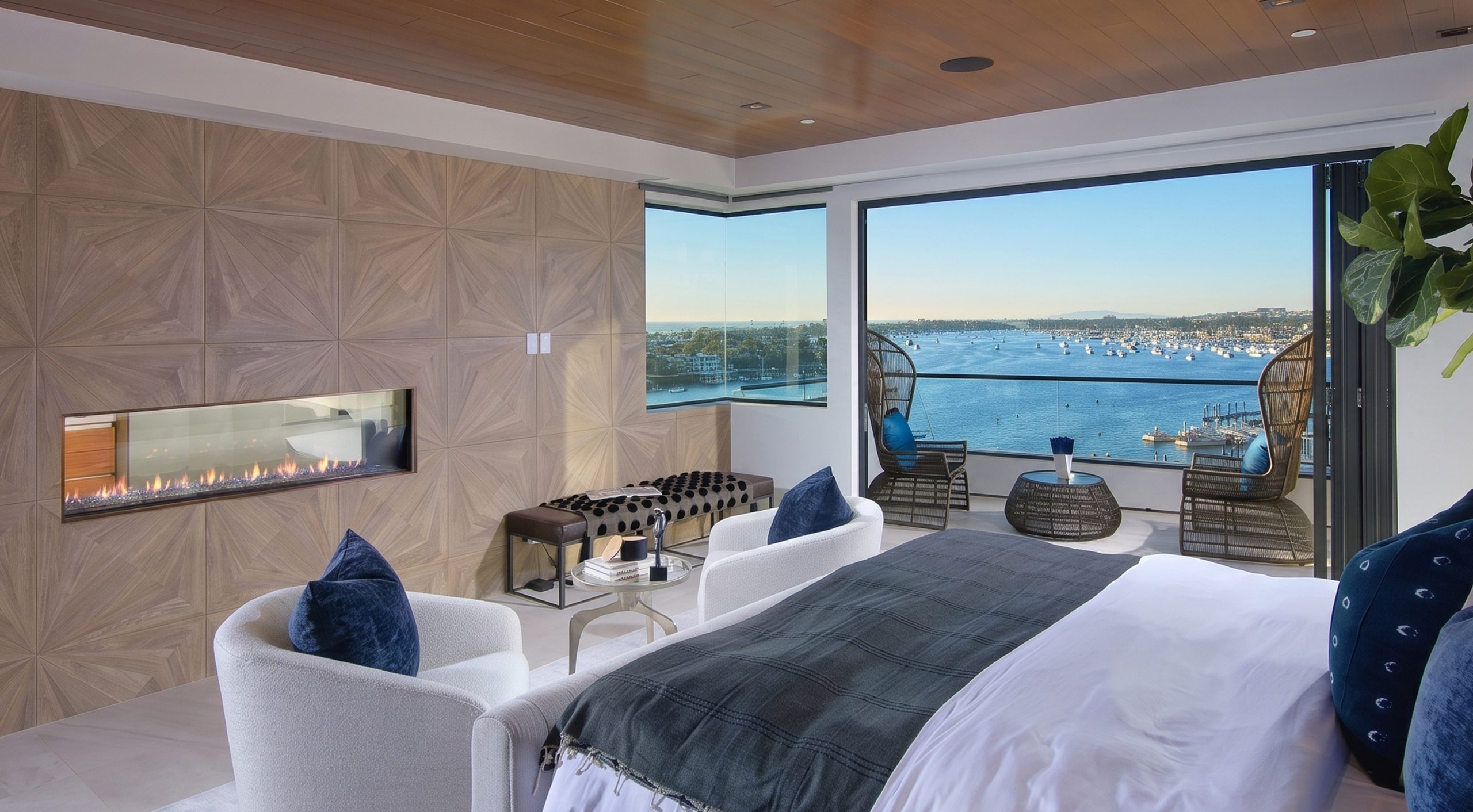 Flare See Through 80 x 16 frameless gas fireplace in a luxury waterfront bedroom