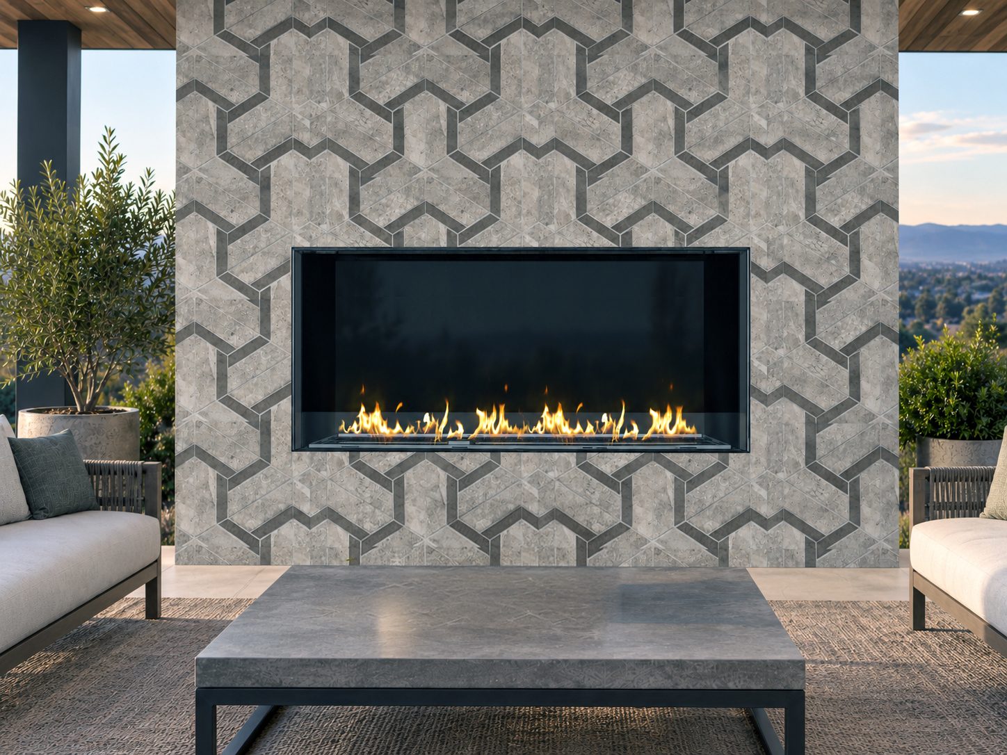 Front view of a 60-inch outdoor vent-free linear fireplace installed in a geometric stone wall within a modern covered patio.