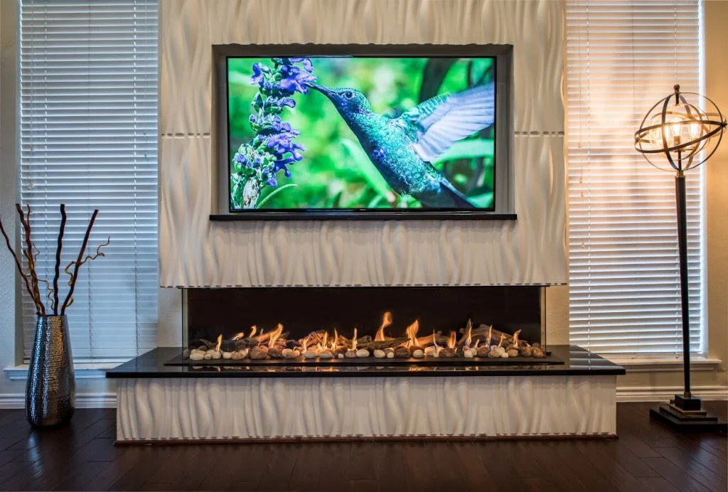 Flare Double Corner 80-inch frameless linear gas fireplace wrapping three glass faces in a contemporary great room